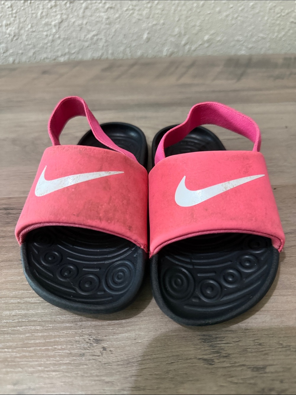 Nike Kids Pink Slide Sandals with White Swoosh and Back Strap